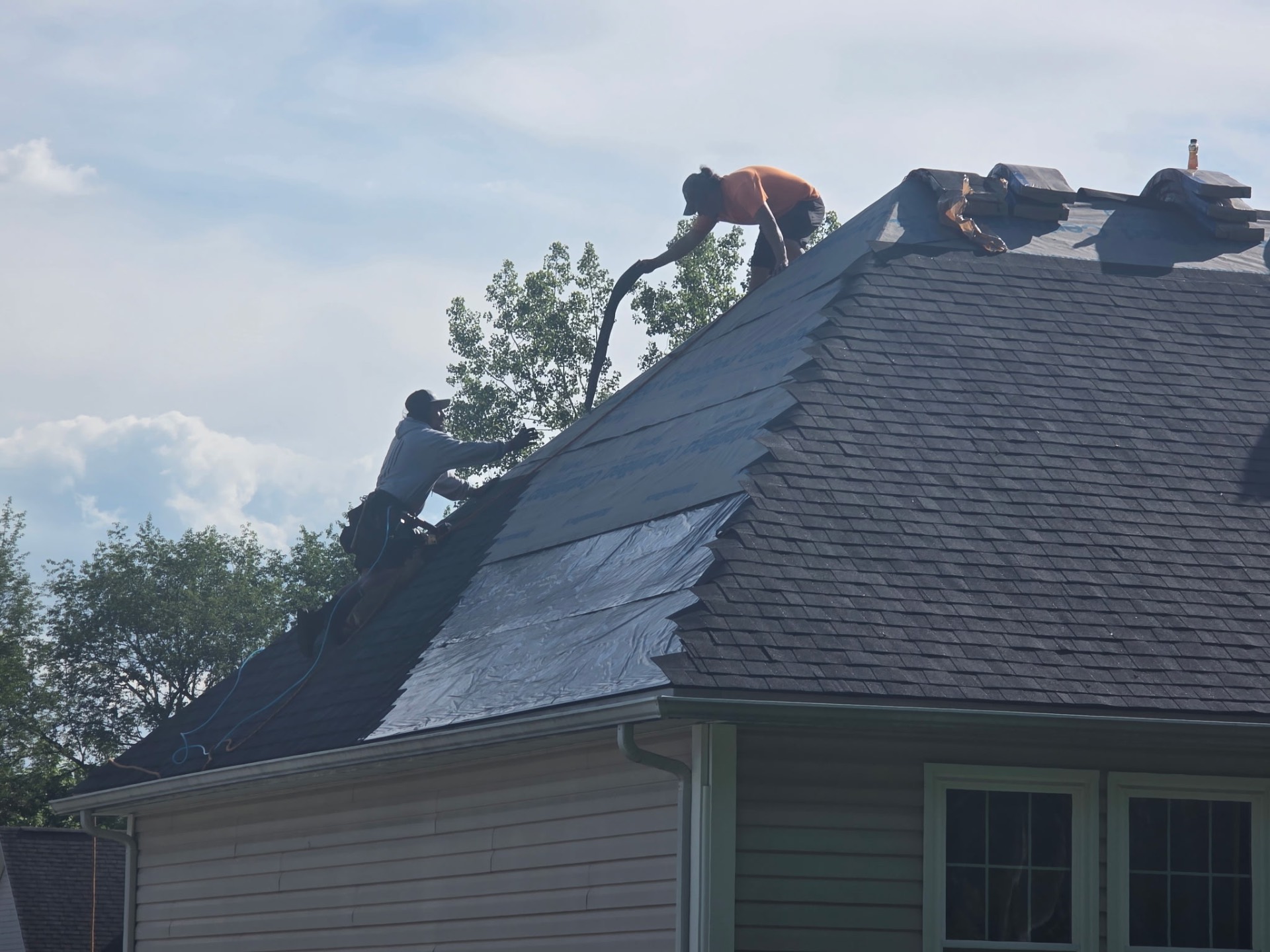 Install in progress — underlayment & shingles going down
