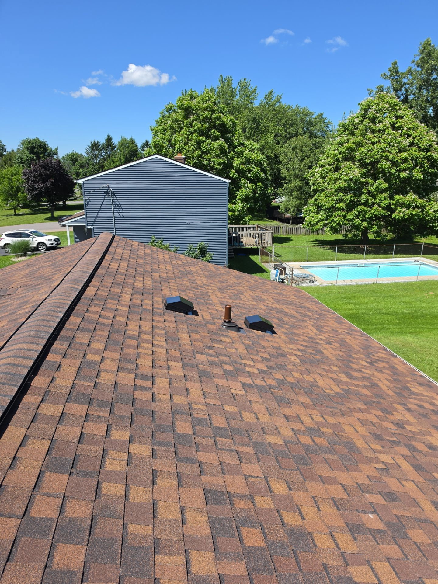 Fresh install — Burnt Sienna with new Lifetime pipe boots & bathroom/kitchen vents (pitched against, 100% silicone boots with Kynar-finish base)