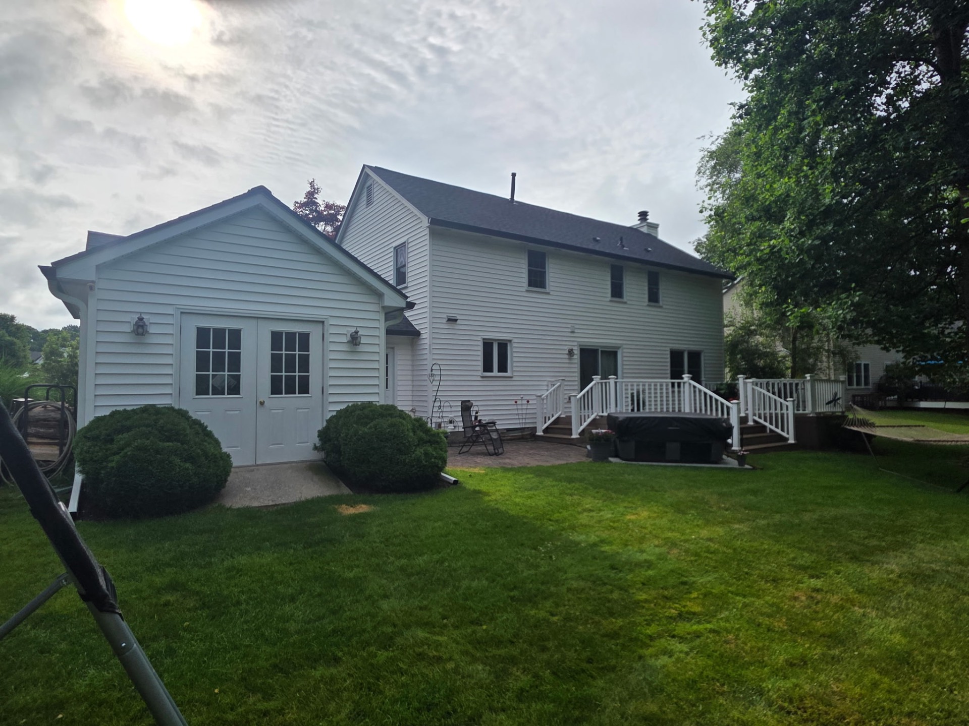 Fresh install — Max Def Moire Black with 6" black seamless gutters & white downspouts