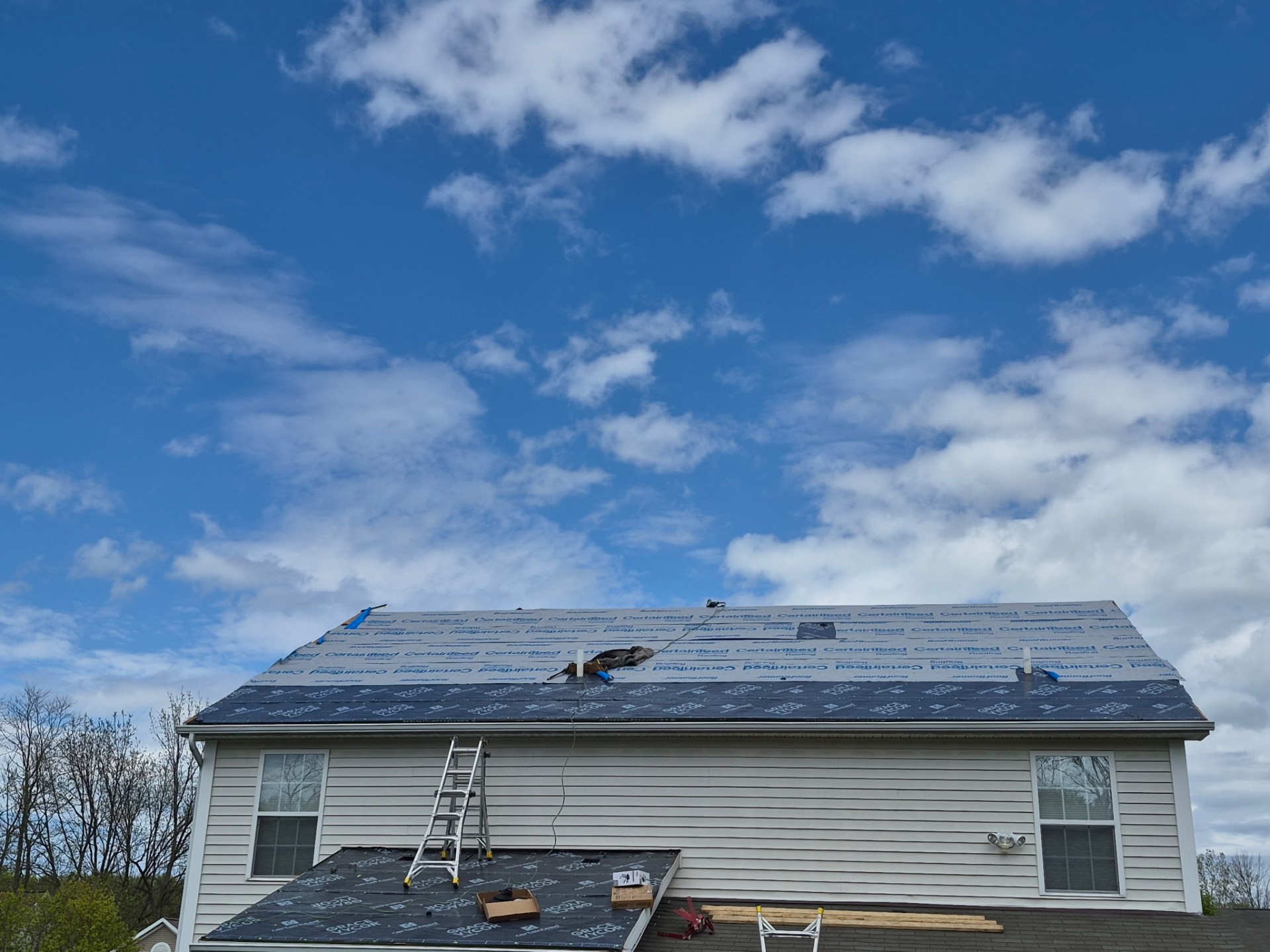 Synthetic underlayment and ice-and-water shield installation on a Rochester-area roof